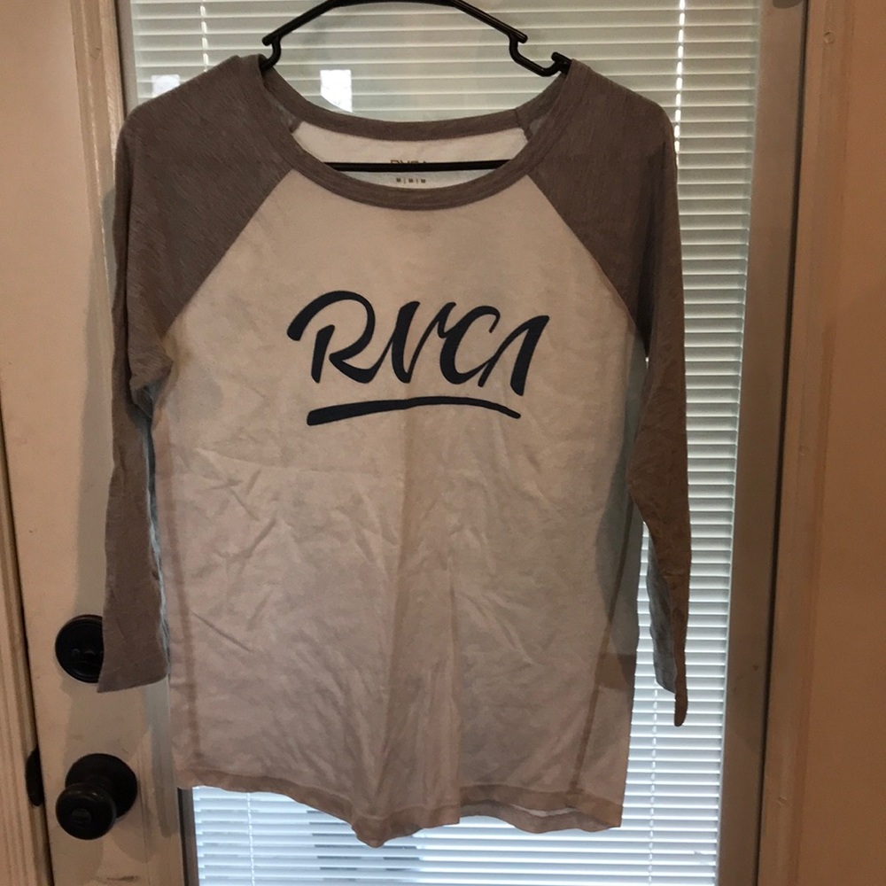 This is a RVCA baseball sleeve shirt it is a little see through